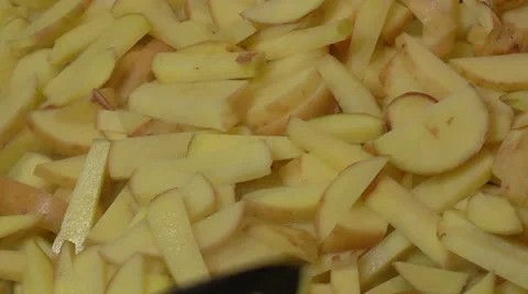 Frying Pan with Sliced Potatoes Stock Footage 39818519