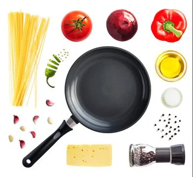 Frying pan, spaghetti and vegetable Stock Photos