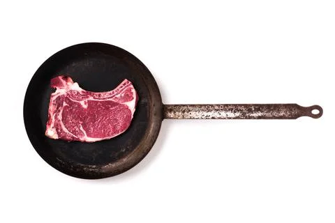 Frying pan with steak isolated 写真素材