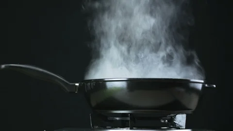 Frying pan steaming Stock Footage 99286461