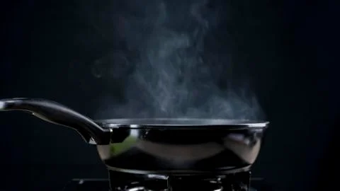 Frying pan steaming Stock Photos