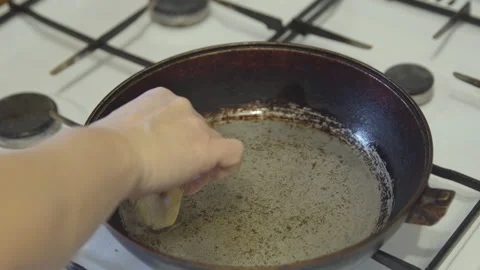 Frying pan on the stove with dough, close-up Stock Footage 85476467