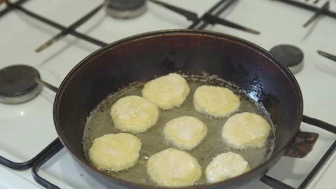 Frying pan on the stove with dough, close-up Stock-Footage 85975220