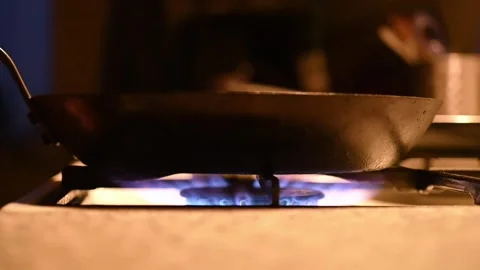 Frying pan on a stove, ignition and blue flame Stock Footage 331090067