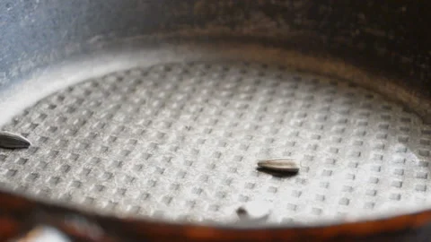 On a frying pan sunflower seeds Stock Footage 93848011