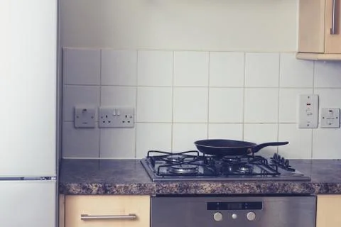 Frying pan in tidy kitchen Photos
