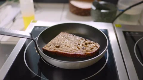 Frying pan with toast in the restaurant kitchen. Stock Footage 277131502