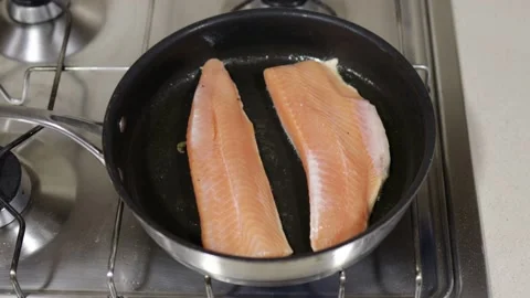Frying pan with two salmon fillet Stock Footage 165331056