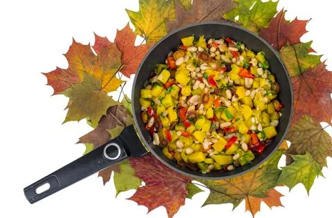 Frying pan with vegetable stew with pumpkin and white beans Stock Photos