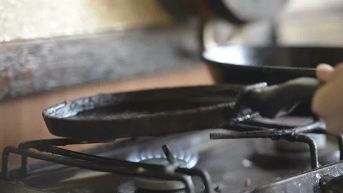 Frying pancakes in a cast-iron pan Stock Footage 145733954