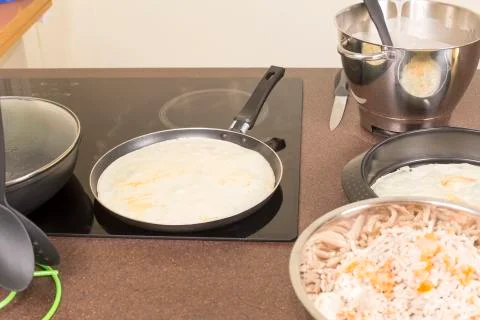 Frying of pancakes Stock Photos