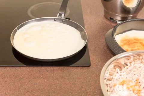 Frying of pancakes Stock Photos