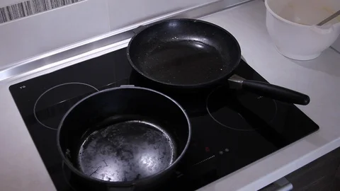 Frying pans on the induction hob. Stock Footage 107712993