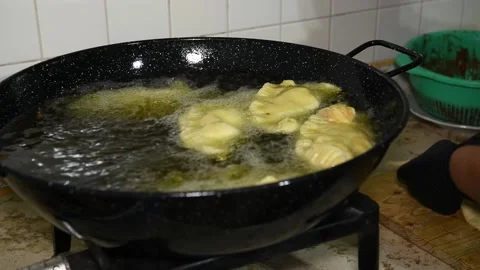 Frying Panzerotti. Female hands putting apulian panzerotti Stock Footage 139924281