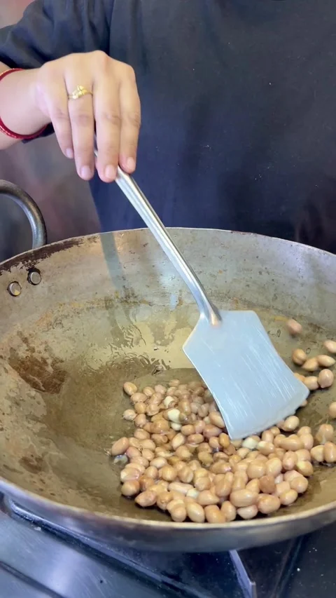 Frying peanut in a frying wok or pan. Stock Footage 287304662