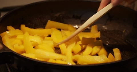 Frying peppers in the pot Stock Footage 129061715