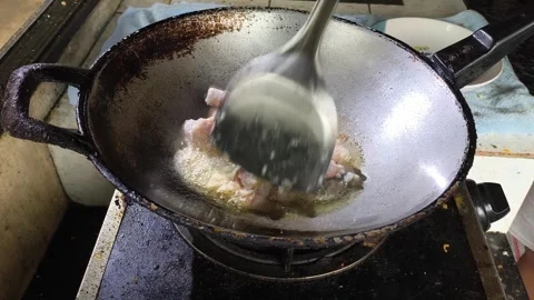 Frying pickled fish in pan, in door Chiangmai Thailand. Stock Footage 310606674