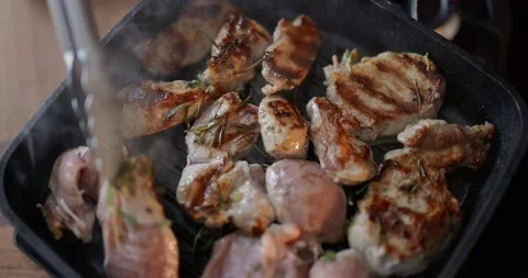 Frying pieces of beef in a pan Stock Footage 146751551