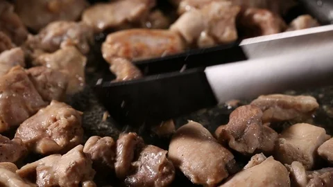Frying pieces of chicken meat Stock Footage 85764155