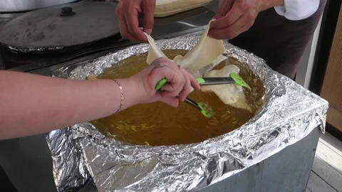 Frying pies on the street. Stock Footage 156920573