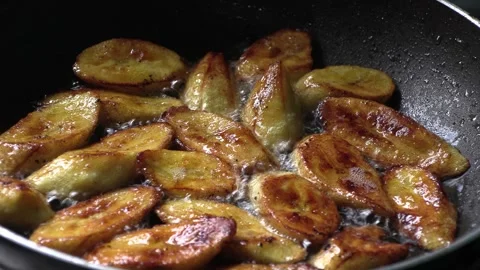 Frying plantain in coconut oil Video stock 295390059