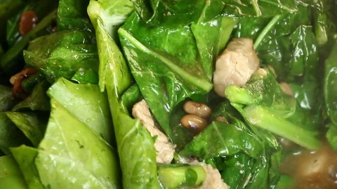 Frying pork and kale to make Radna, Thaifood. Stock Footage 83439300
