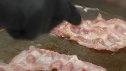 Frying Pork Bacon Strips in Pan Close Up Slow Motion Stock Footage 331634008