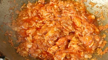 Frying pork with chili paste in pan  Stock Footage 86091407