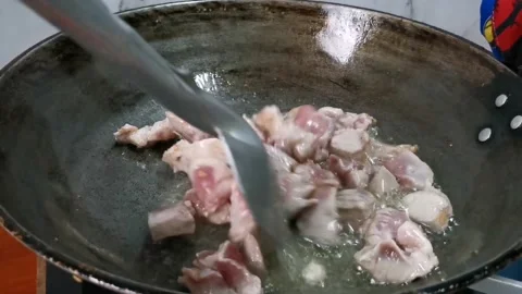 Frying Pork Cubes in a Frying Pan Stock Footage 157676520