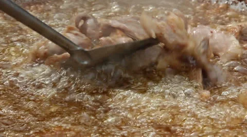 Frying pork Stock Footage 25919629