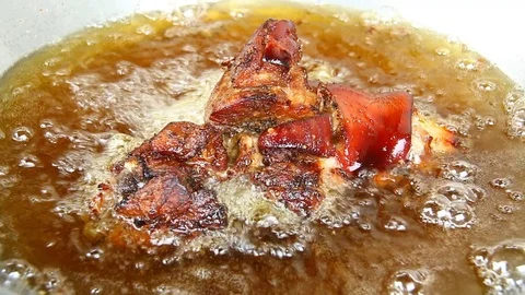 Frying pork leg  in pan Stock Footage 88953606