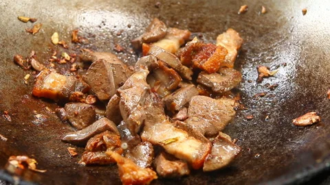 Frying pork liver with crispy pork and morning glory in pan, Chiangmai Thailand Stock Footage 132556510