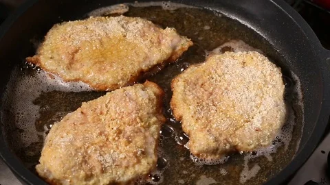 Frying pork meat coated with breadcrumbs Stock Footage 83183045