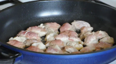 Frying pork meat on pan Stock Footage 22749969