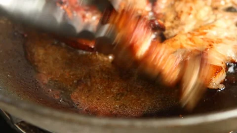 Frying pork steak in pan , in door  Chiangmai  Thailand Stock Footage 141166146