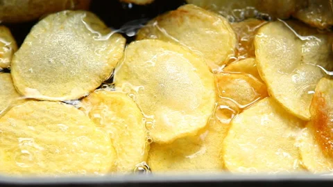 Frying potato chips in pot, in door  Chiangmai  Thailand Stock Footage 153370541