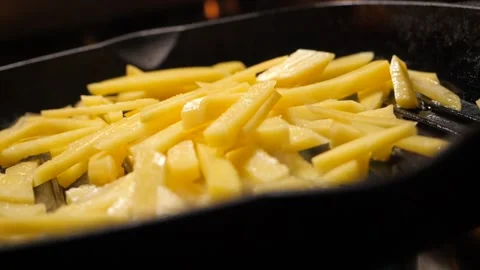 Frying potato on a pan Stock Footage 146396802