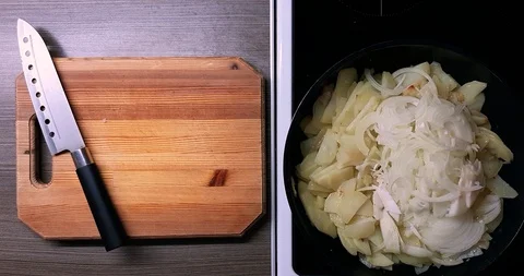 Frying potatoes and onions in a deep pan, top view. Stock Footage 128257810
