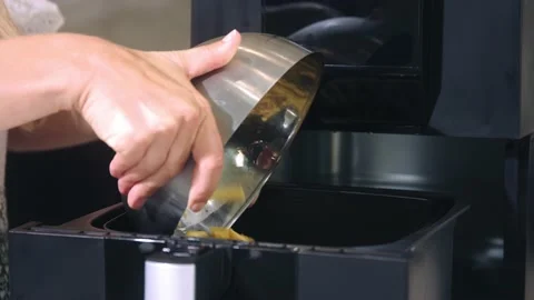 Frying potatoes in a deep fryer Stock Footage 219883581