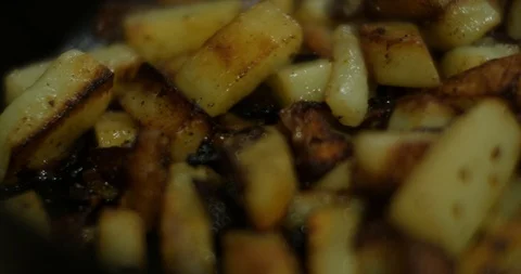 Frying potatoes on the frying pan Stock Footage 86978862