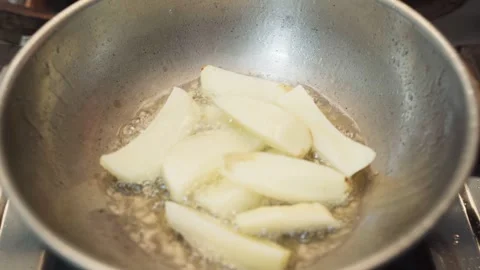 Frying potatoes in a frying pan for making French fries. Stock Footage 282567190
