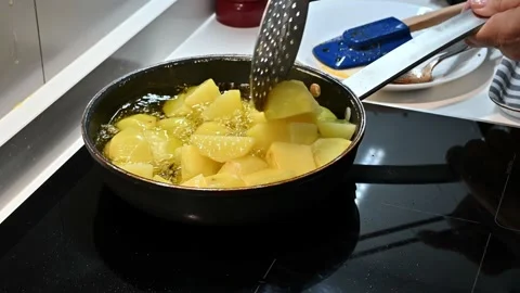 Frying potatoes in the pan with oil Stock Footage 221355809