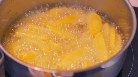 Frying potatoes in a pot slow motion Stock Footage 114076827