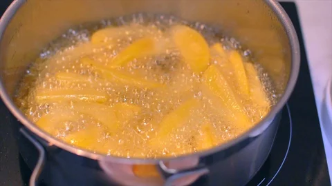 Frying potatoes in a pot slow motion Stock Footage 114078504
