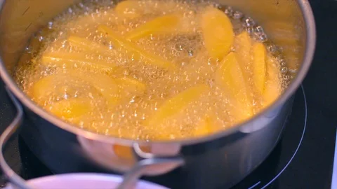 Frying potatoes in a pot slow motion Stock Footage 114079402