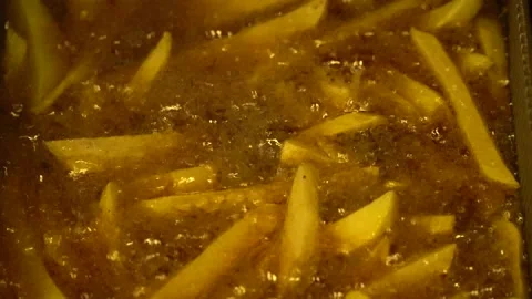 Frying potatoes at a restuarant kitchen Stock Footage 145650009