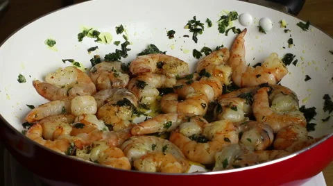 Frying prawn, adding lemon juice. Stock Footage 55709664
