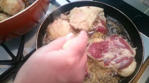 Frying process of duck pieces Stock Footage 86790251