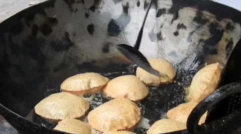 Frying puri in the oil Stock Footage 66502336