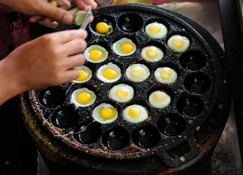 Frying Quail Eggs Stock Photos